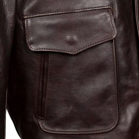 Functional pockets and trim details of the men's vintage leather jacket.