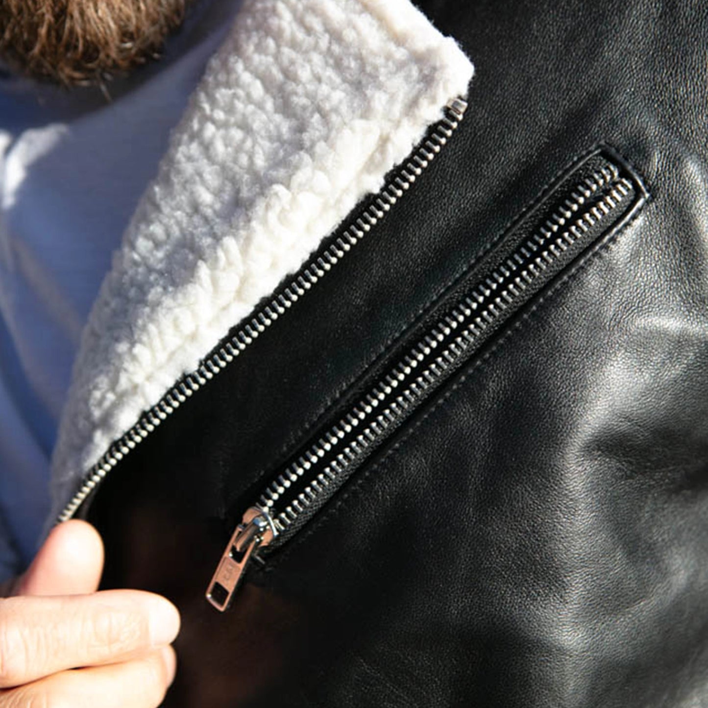 Close-up of the soft white shearling lining on the Alberto White Shearling Leather Jacket