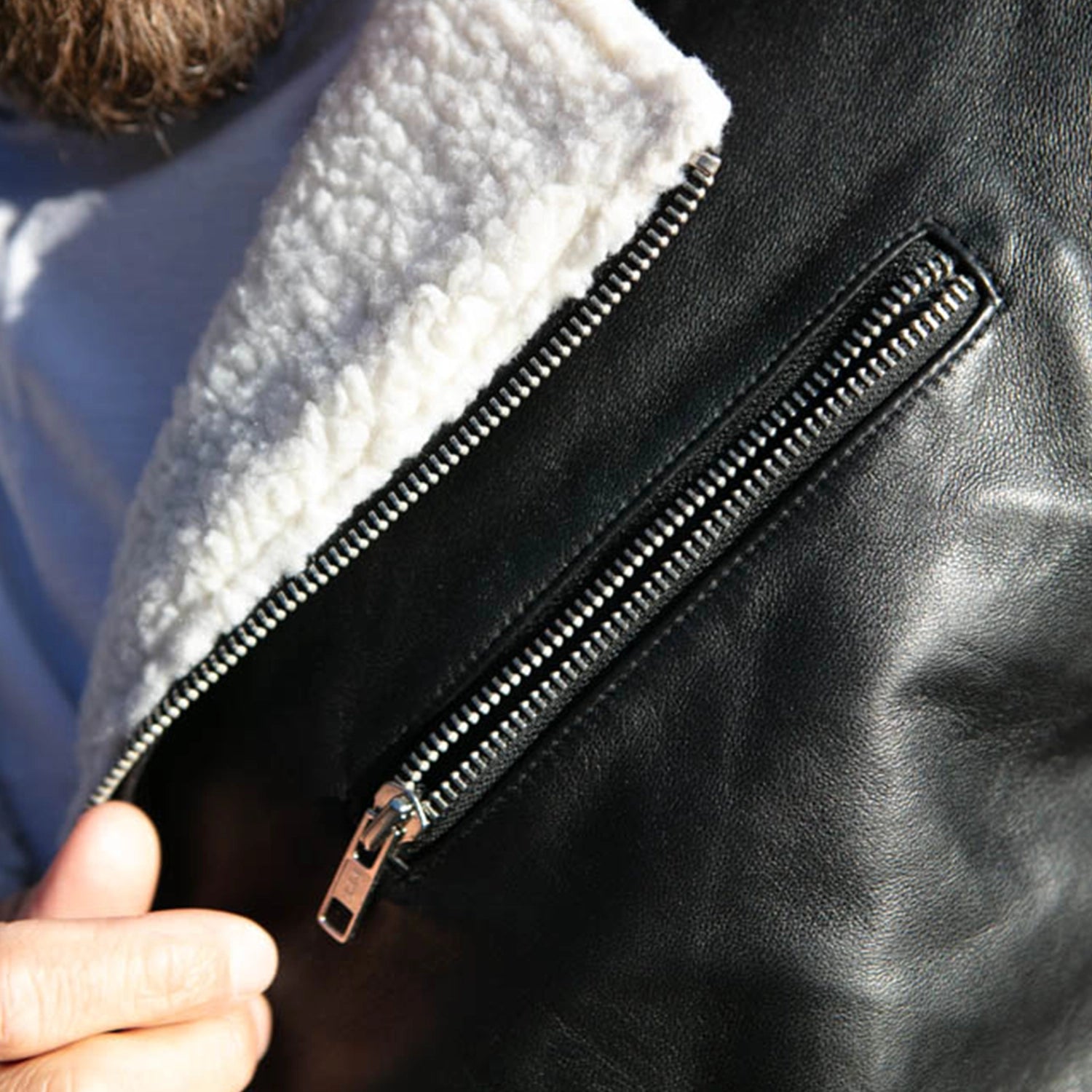 Close-up of the soft white shearling lining on the Alberto White Shearling Leather Jacket