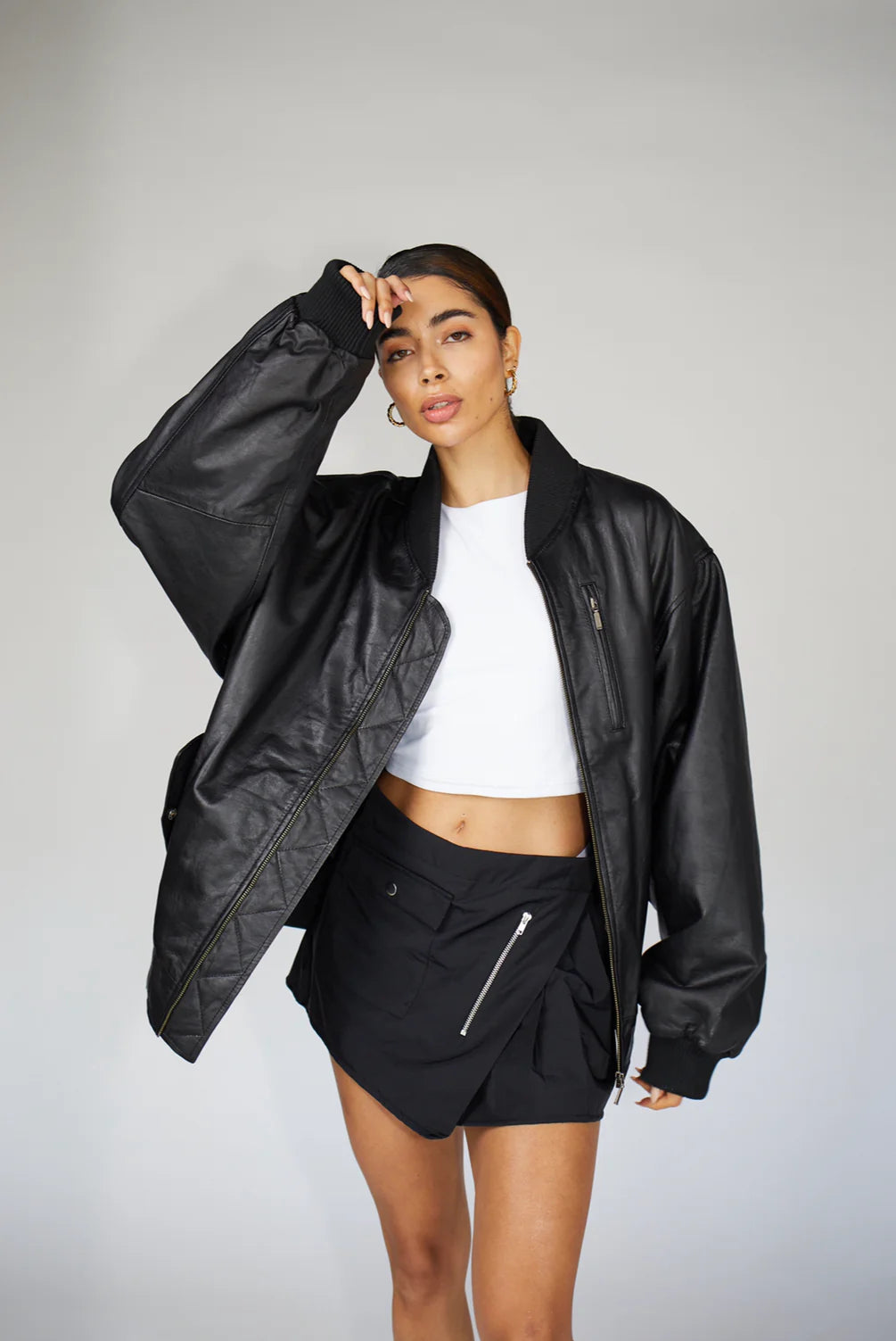 Model wearing the 90s-Inspired Oversized Bomber Leather Jacket for Women