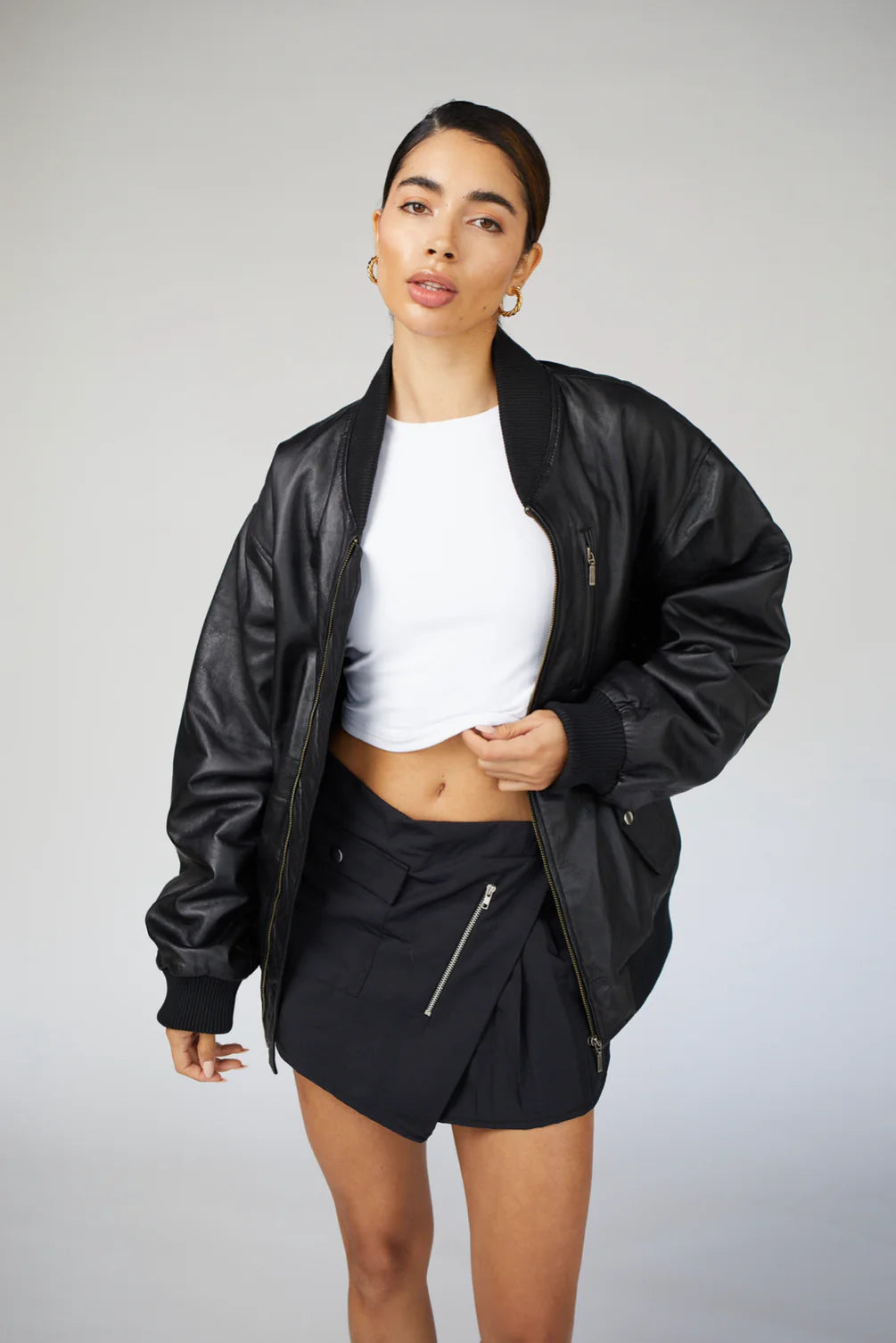 Model showcasing the 90s-Inspired Oversized Bomber Leather Jacket for Women, perfect for casual or party looks