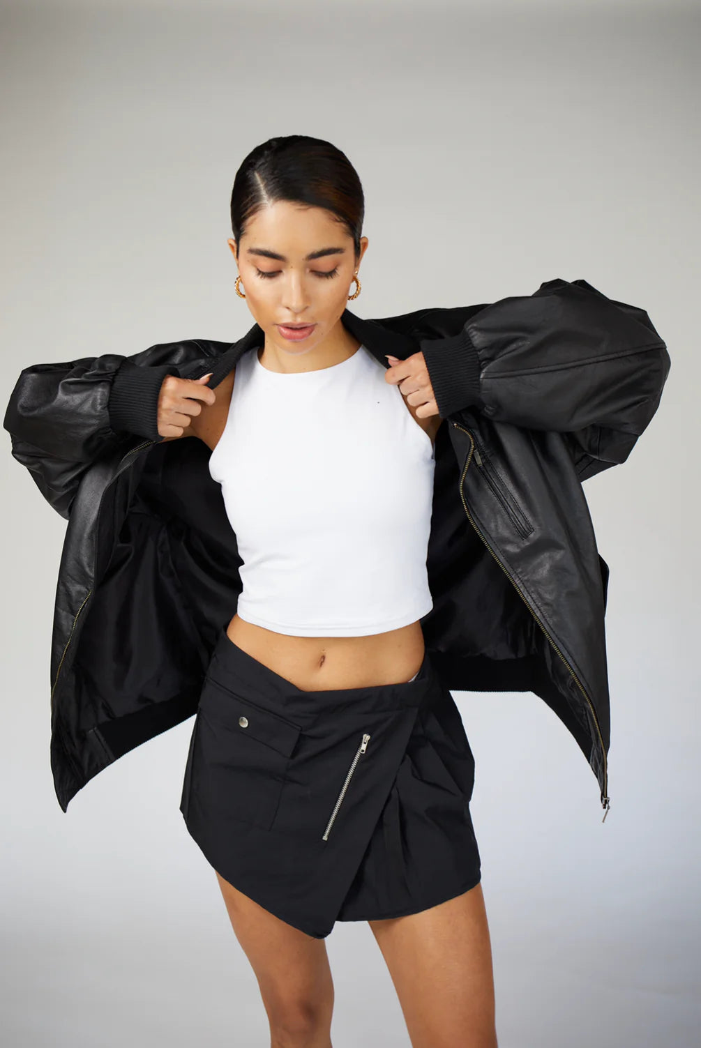 90s-Inspired Oversized Bomber Leather Jacket for Women with a classic front zipper design and oversized fit